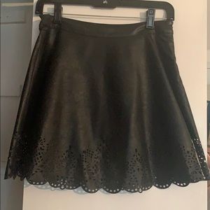 Black leather skirt with embroidered bottom